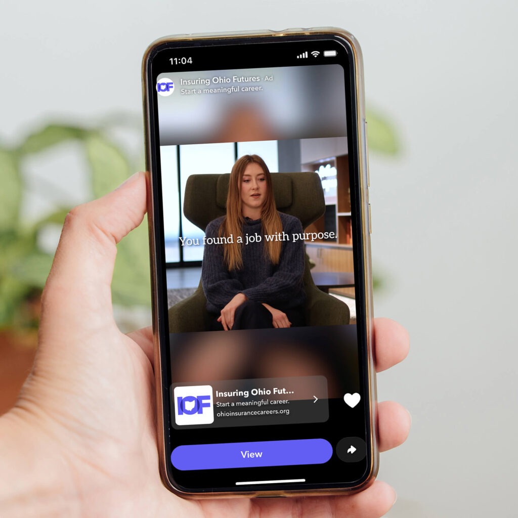 Insuring Ohio Futures ad on a phone screen, featuring a woman and the text
