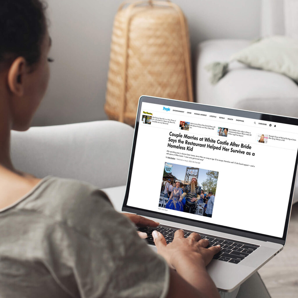 Laptop showing People article about White Castle couple marrying after restaurant helped homeless kid